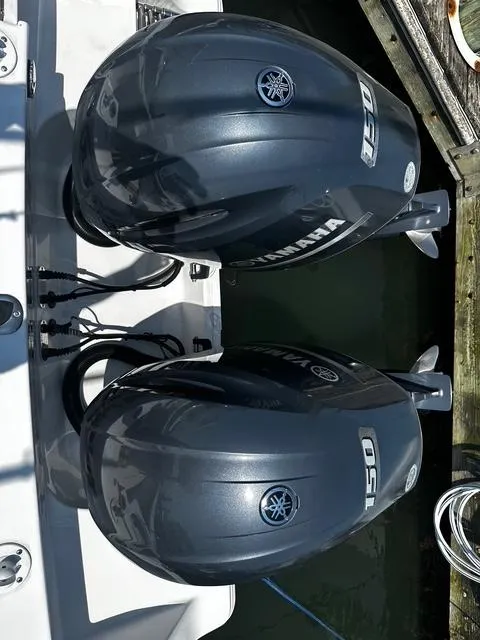 Slide: The Image of Twin Yamaha 150 engines on a 2018 Sportsman Open 252 Center Console boat. - 30