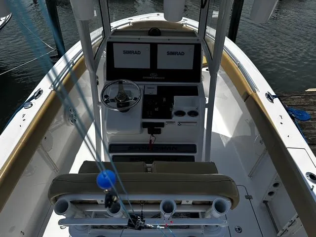 Slide: The Image of 2018 Sportsman Open 252 Center Console boat with dual Simrad displays, docked on water. - 33