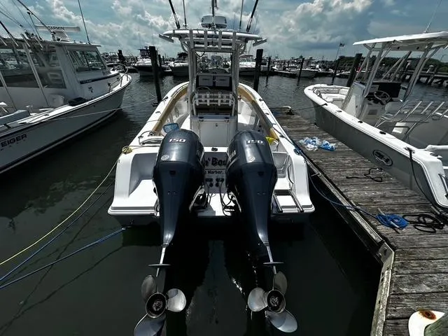 Slide: The Image of 2018 Sportsman Open 252 Center Console boat docked with twin engines. - 34