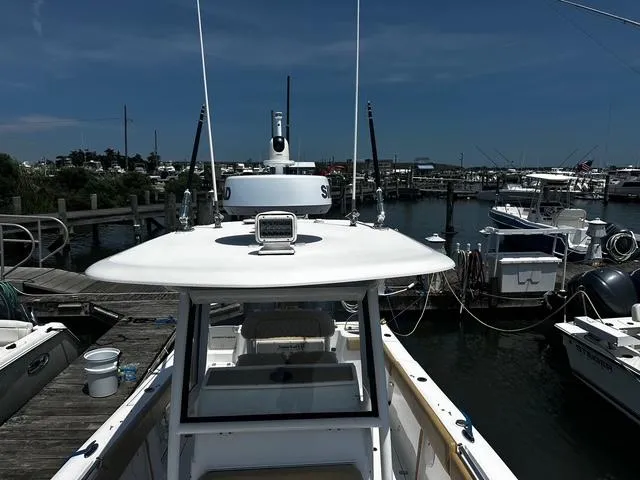 Slide: The Image of 2018 Sportsman Open 252 Center Console boat docked at marina. - 7