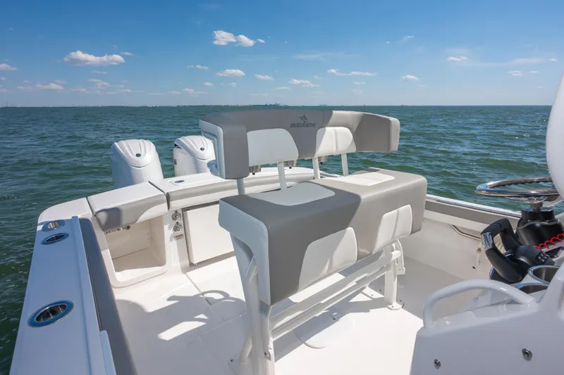 Slide: The Image of 2026 Regulator 23 boat interior with dual engines on open water. - 17