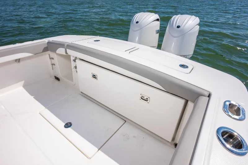 Slide: The Image of 2026 Regulator 23 boat interior with dual outboard motors on water. - 12