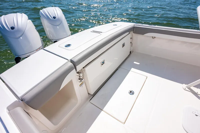 Slide: The Image of 2026 Regulator 23 boat interior with dual outboard motors on the water. - 14