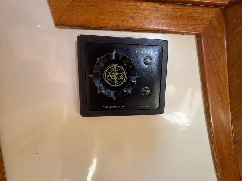 Slide: The Image of ACR Electronics control panel on 1999 Hinckley Picnic boat interior. - 13