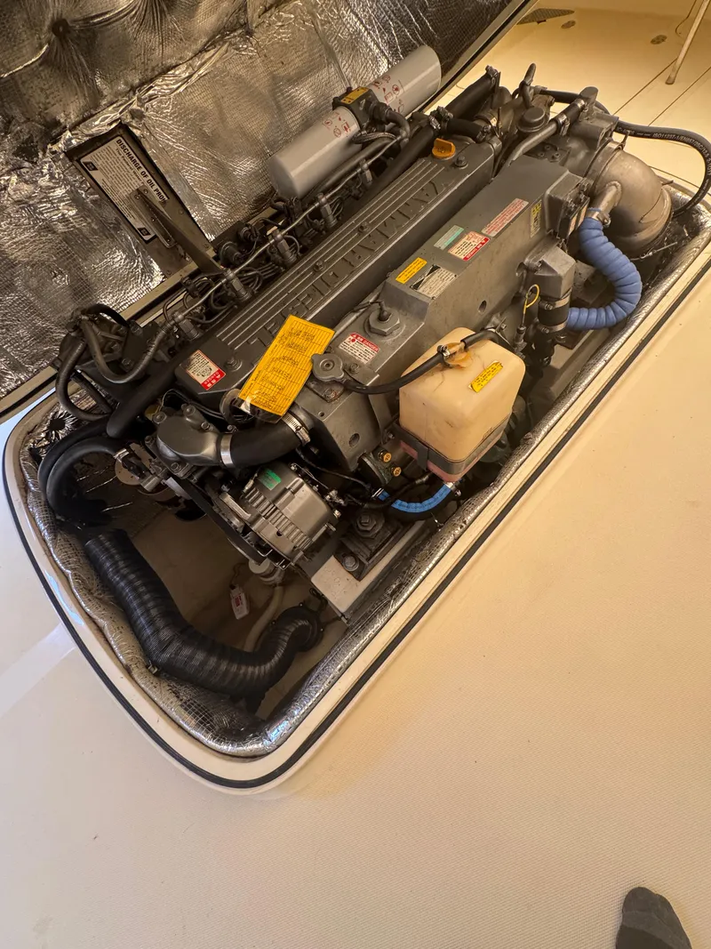 Slide: The Image of 1999 Hinckley Picnic boat engine compartment with detailed mechanical components. - 17