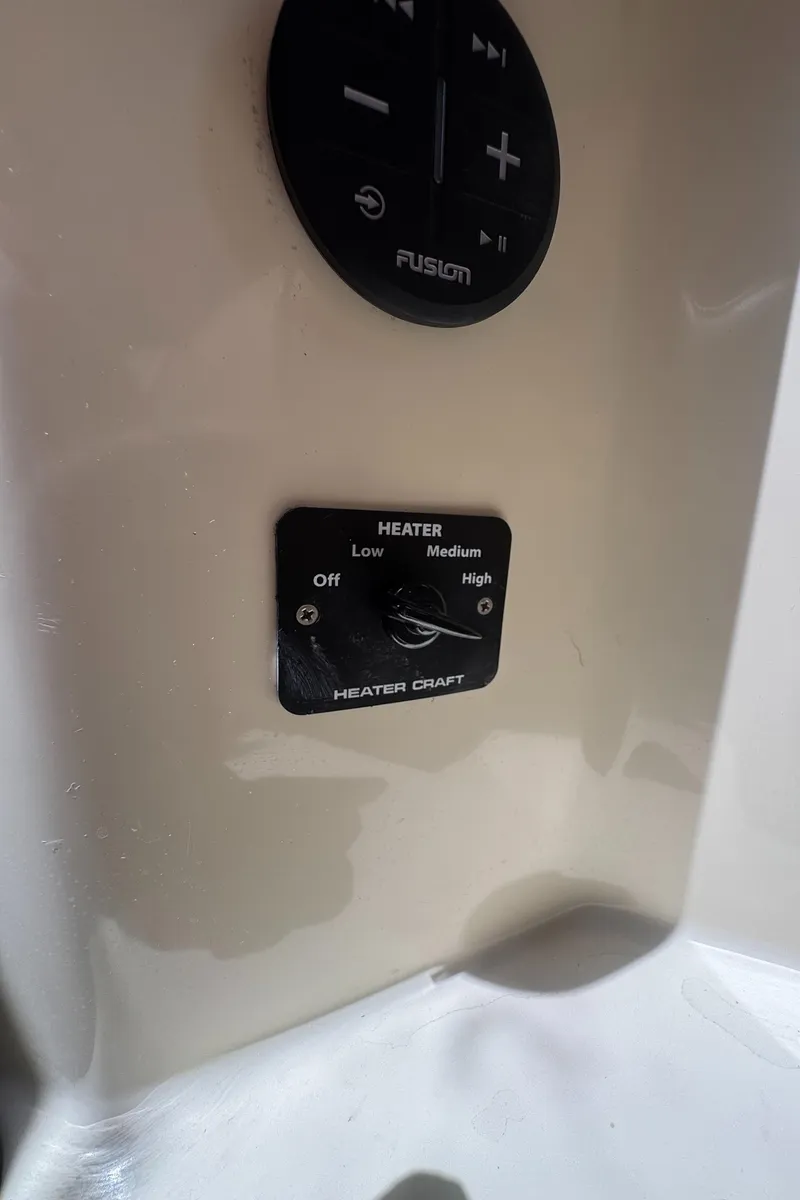 Slide: The Image of Heater control panel on a 1999 Hinckley Picnic boat, featuring adjustable settings. - 25