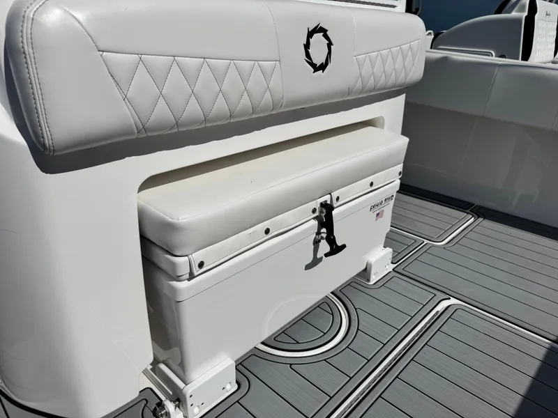 Slide: The Image of 2025 Fountain 34 TE boat interior with cushioned seating and storage compartment. - 19