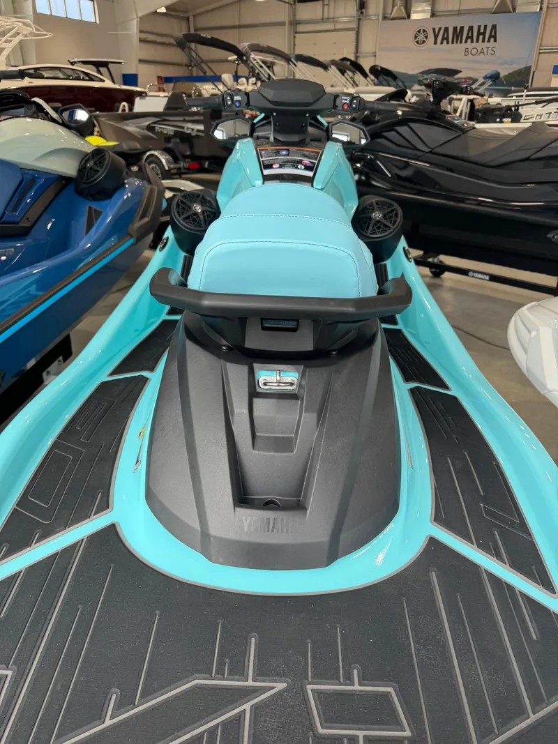 Slide: The Image of 2025 Yamaha WaveRunner VX Limited HO in showroom, featuring sleek design and turquoise accents. - 9