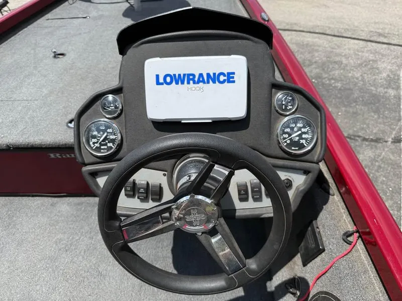 Slide: The Image of 2023 Ranger RT 188 boat dashboard with Lowrance Hook5 display and steering wheel. - 10