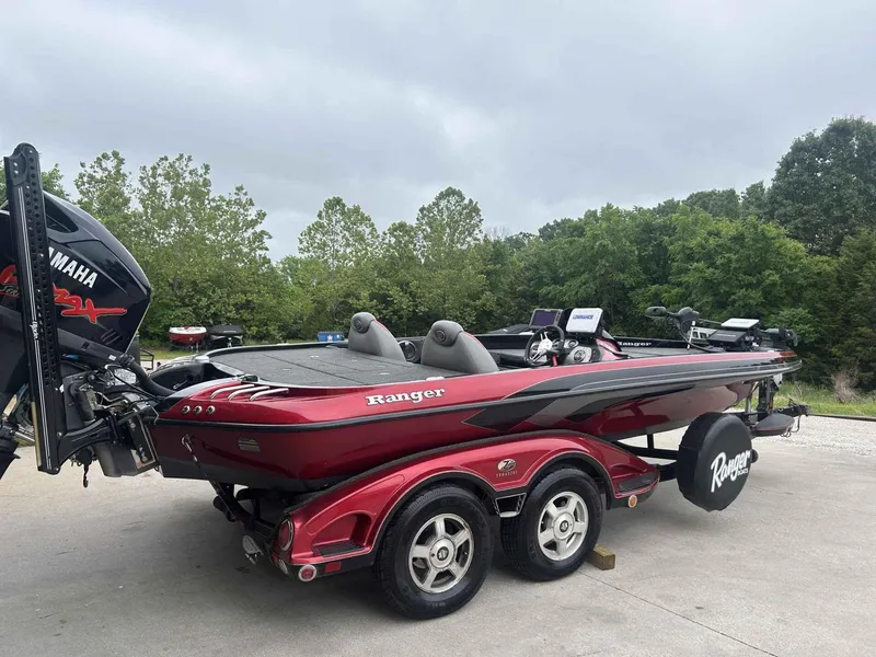 Slide: The Image of 2009 Ranger Z520 bass boat with Yamaha engine on trailer, parked outdoors. - 3