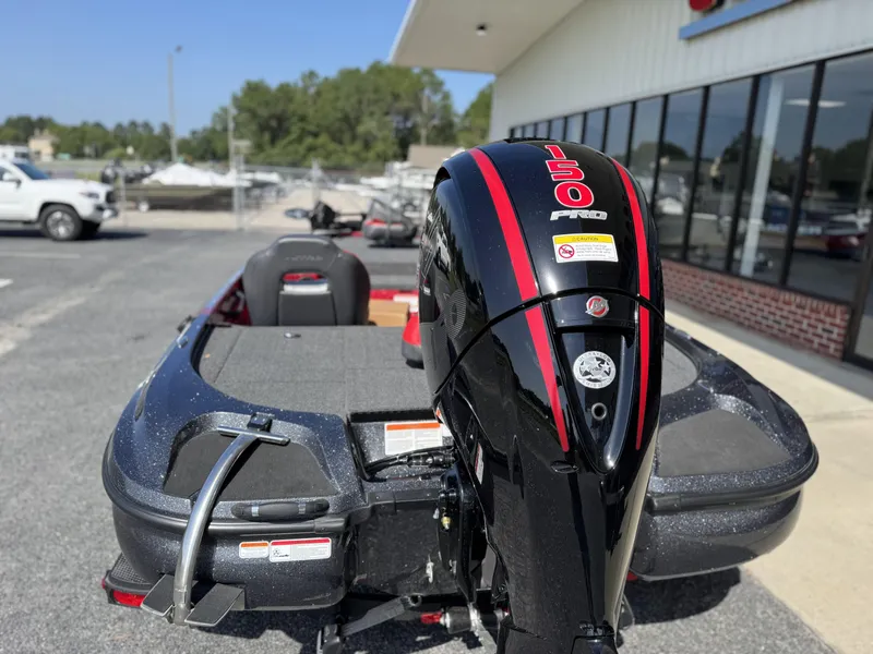 Slide: The Image of 2026 Nitro Z18 boat with a 150 Pro motor, parked outside a dealership. - 3