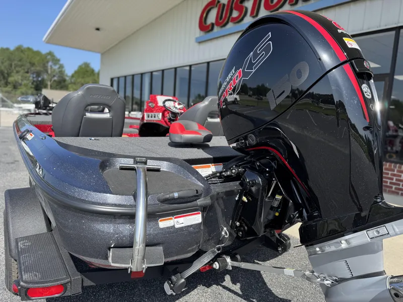 Slide: The Image of 2026 Nitro Z18 boat with Mercury Pro XS 150 engine, parked outside a dealership. - 4
