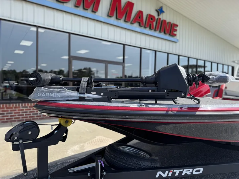 Slide: The Image of 2026 Nitro Z18 boat with Garmin equipment outside a marine dealership. - 6