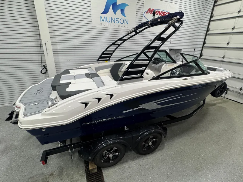 Slide: The Image of 2025 Chaparral 21 SSi boat in showroom, featuring sleek design and modern features. - 18