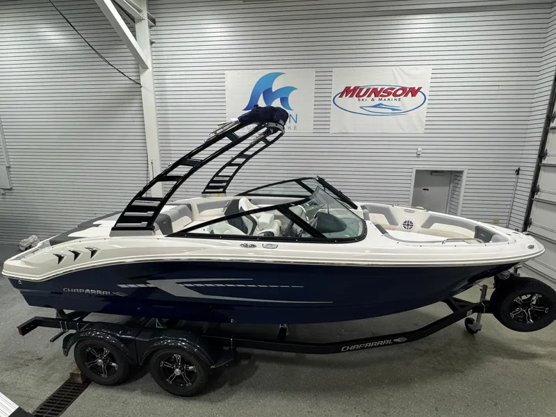 Slide: The Image of 2025 Chaparral 21 SSi boat in showroom, featuring sleek design and modern features. - 3