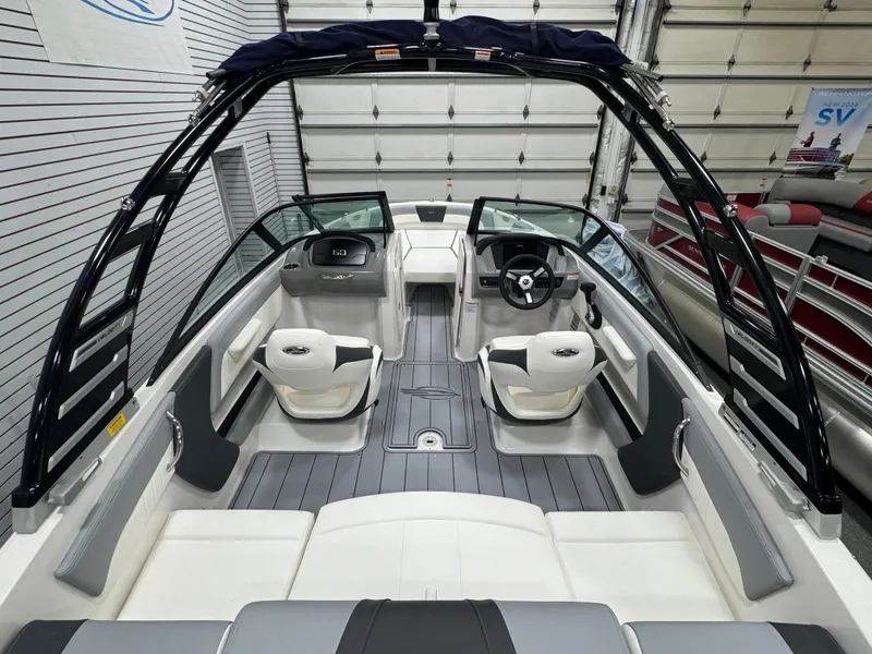 Slide: The Image of 2025 Chaparral 21 SSi boat interior with modern seating and sleek design. - 7
