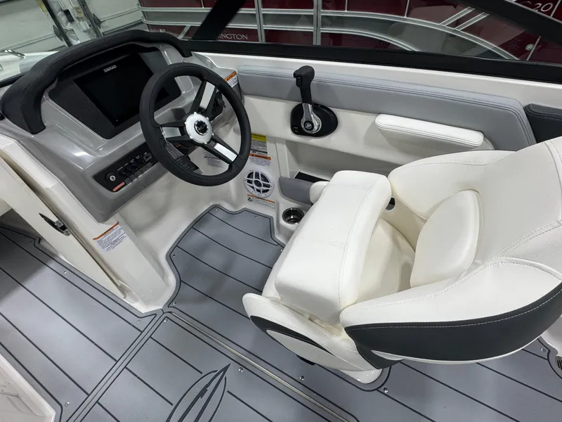 Slide: The Image of 2025 Chaparral 21 SSi boat interior with steering wheel and captain's seat. - 8