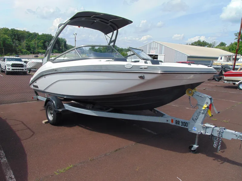 Slide: The Image of 2020 Yamaha Boats 195S on trailer in parking lot, sunny day. - 1