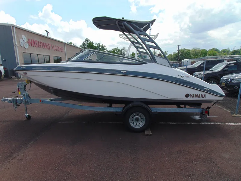 Slide: The Image of 2020 Yamaha Boats 195S on trailer at Highway Marine dealership. - 3
