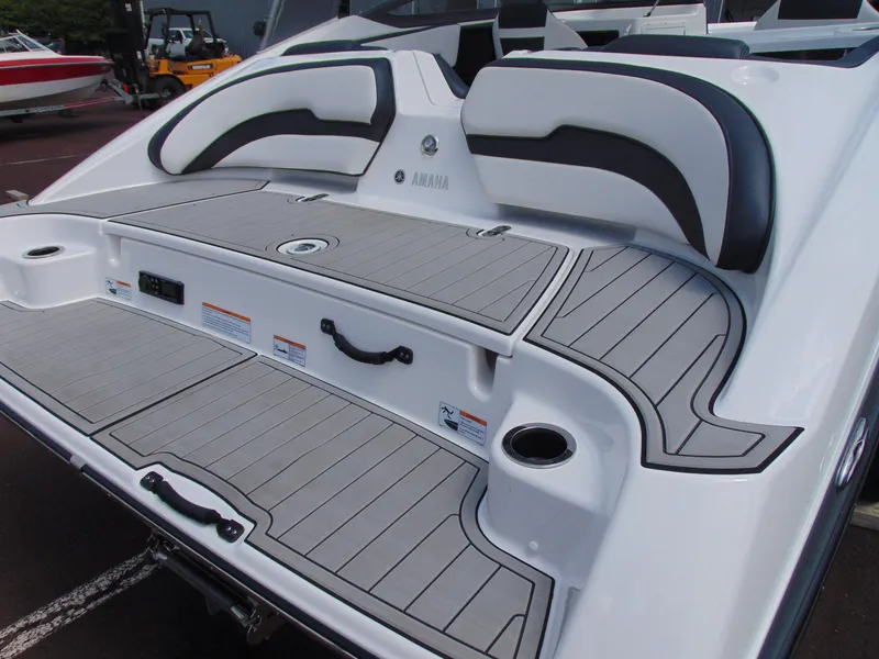 Slide: The Image of 2020 Yamaha Boats 195S swim platform with cushioned seating and sleek design. - 7