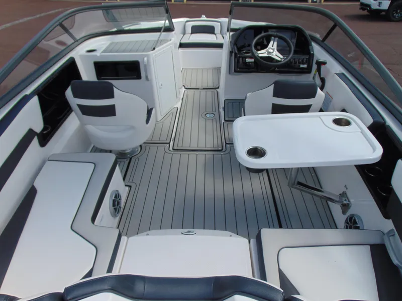 Slide: The Image of 2020 Yamaha Boats 195S interior with seating, steering wheel, and table. - 8