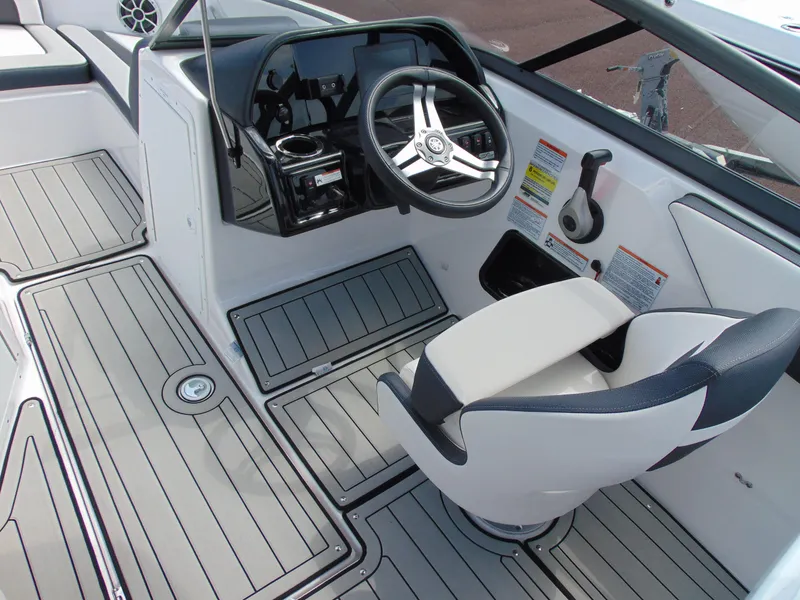 Slide: The Image of 2020 Yamaha Boats 195S cockpit with steering wheel and captain's chair, featuring sleek design. - 9