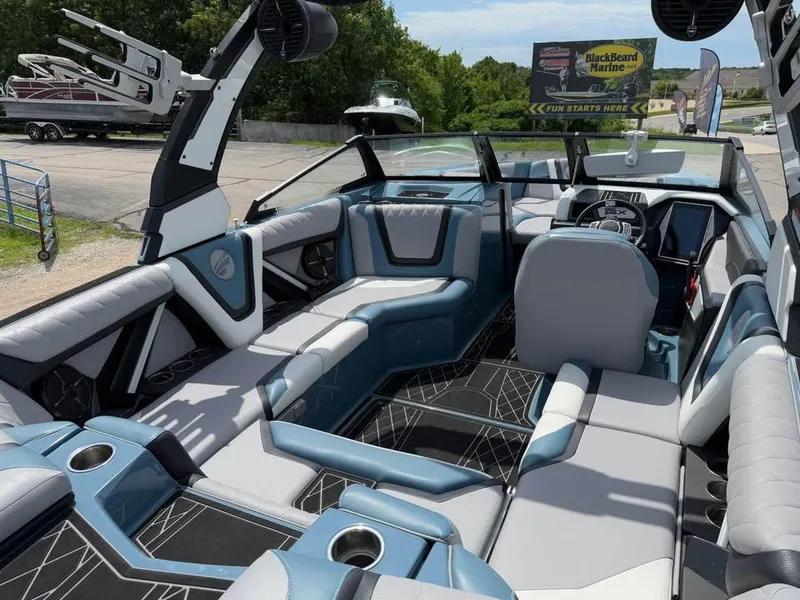Slide: The Image of 2022 Tigé 21ZX boat interior with modern seating and sleek design. - 9