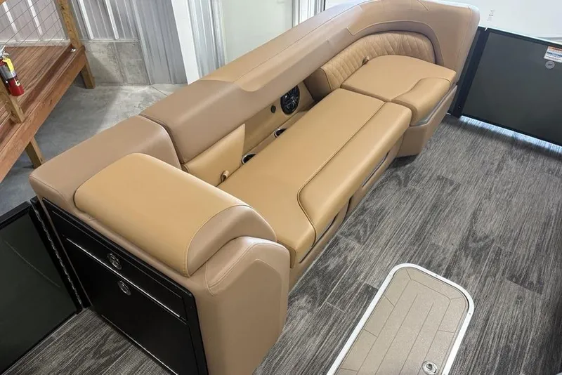 Slide: The Image of Luxurious tan seating on 2025 Godfrey Sweetwater 2286 SB pontoon boat, showcasing comfort and style. - 12