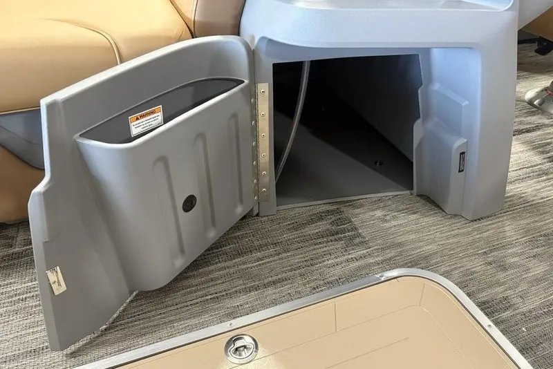Slide: The Image of Open storage compartment on 2025 Godfrey Sweetwater 2286 SB pontoon boat. - 14