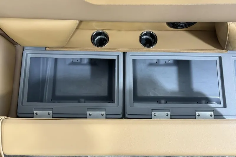 Slide: The Image of Interior storage compartments of 2025 Godfrey Sweetwater 2286 SB boat with cup holders. - 15