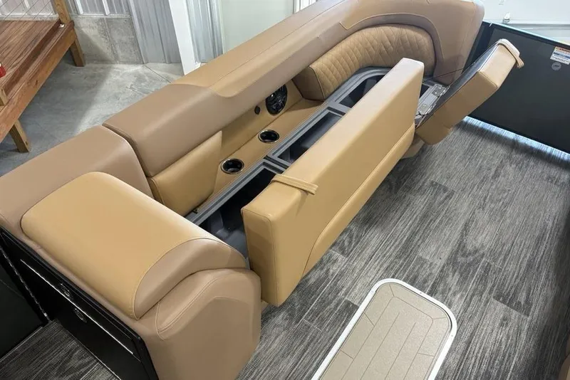 Slide: The Image of Luxurious seating on 2025 Godfrey Sweetwater 2286 SB pontoon boat, featuring tan upholstery. - 16
