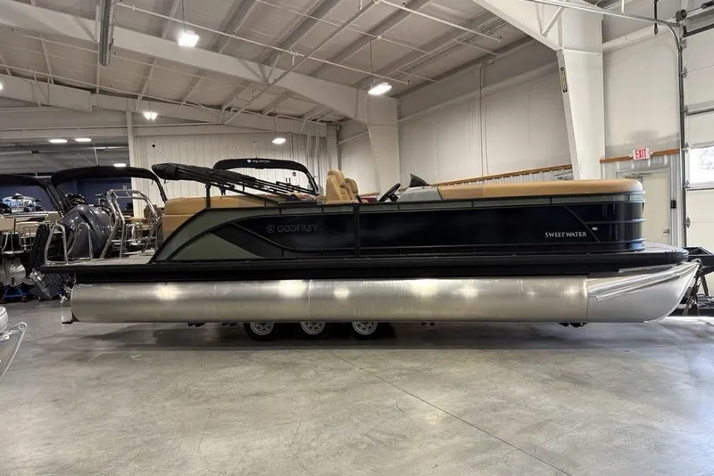 The Image of 2025 Godfrey Sweetwater 2286 SB pontoon boat in showroom, featuring iMPACT Center Tube Package. - 2
