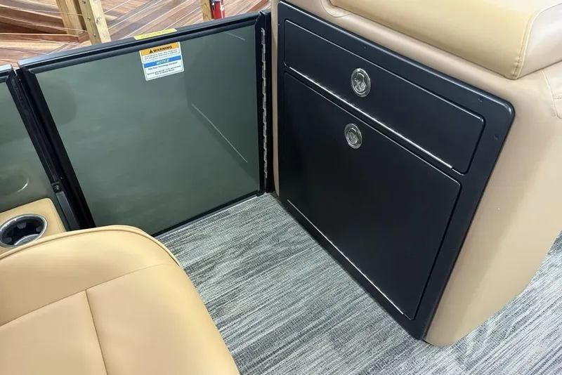 Slide: The Image of Interior of 2025 Godfrey Sweetwater 2286 SB boat, featuring storage compartments and seating. - 20