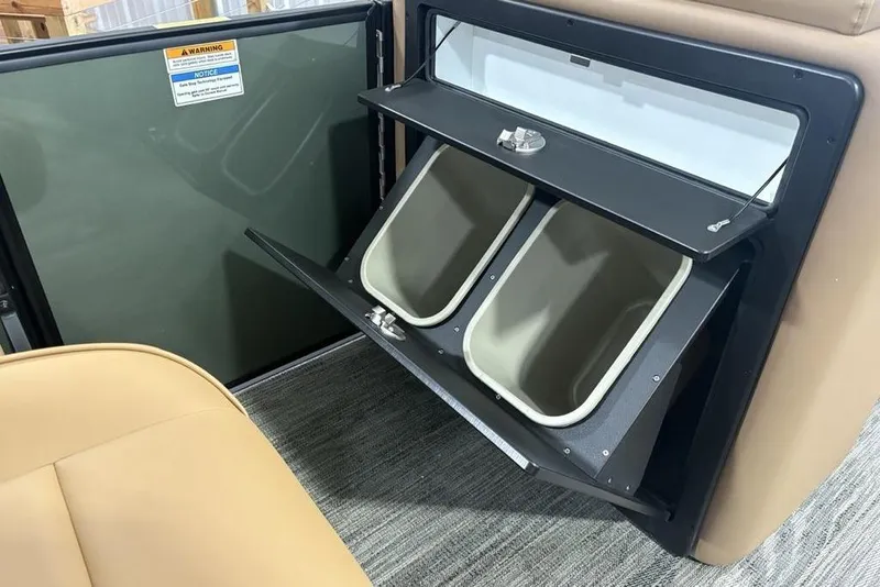 Slide: The Image of Storage compartment with dual bins in 2025 Godfrey Sweetwater 2286 SB boat interior. - 21