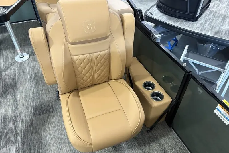 Slide: The Image of Luxurious tan seating on 2025 Godfrey Sweetwater 2286 SB pontoon boat with cup holders. - 22