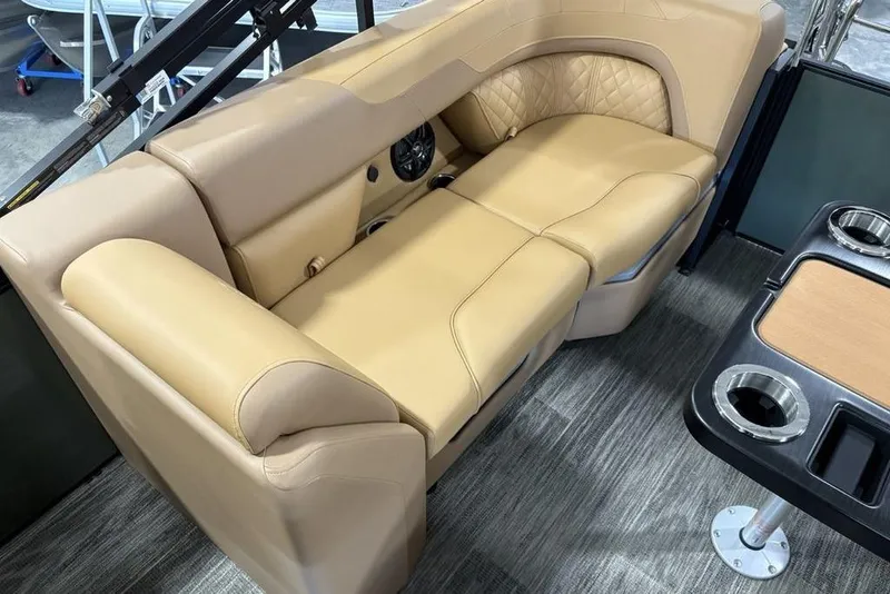 Slide: The Image of Luxurious seating on 2025 Godfrey Sweetwater 2286 SB pontoon boat with tan upholstery. - 25