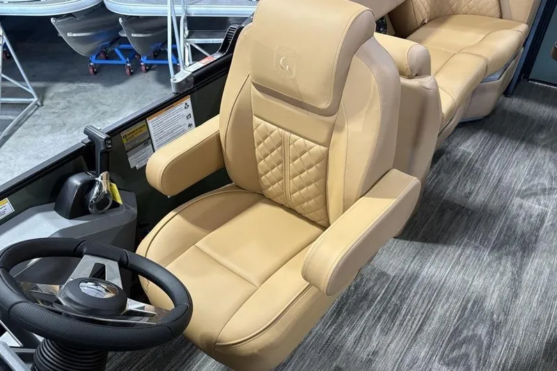 Slide: The Image of Luxurious tan seating in 2025 Godfrey Sweetwater 2286 SB boat, featuring elegant design and comfort. - 28