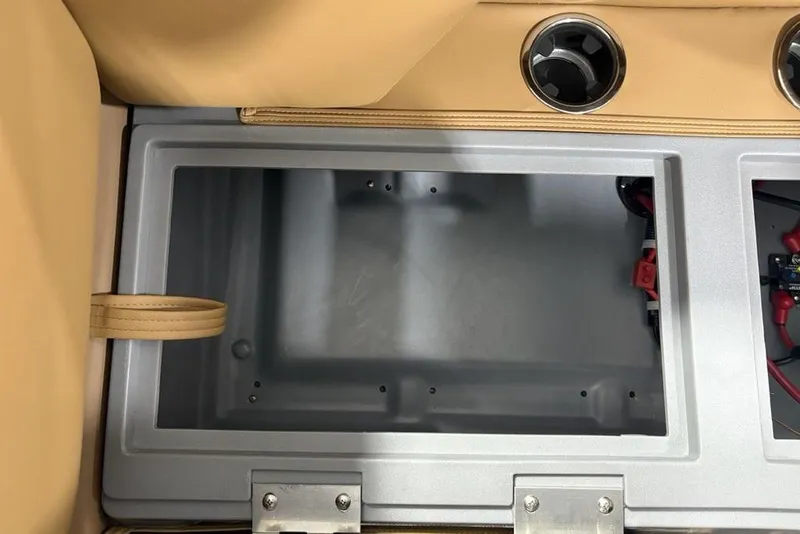 Slide: The Image of Interior storage compartment of 2025 Godfrey Sweetwater 2286 SB boat, featuring cup holders. - 29