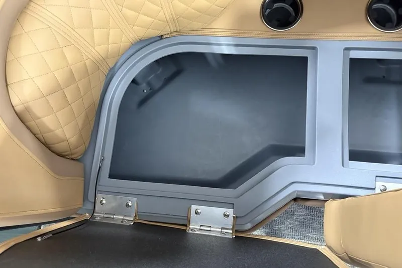 Slide: The Image of Interior of 2025 Godfrey Sweetwater 2286 SB with tan quilted seating and storage compartments. - 34