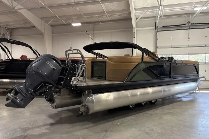 Slide: The Image of 2025 Godfrey Sweetwater 2286 SB pontoon boat with Yamaha motor in a showroom. - 7