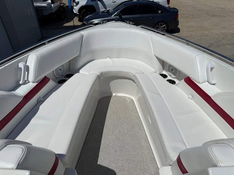 Slide: The Image of 2001 Formula F-260 boat interior with white and red seating, cup holders, and speakers. - 11