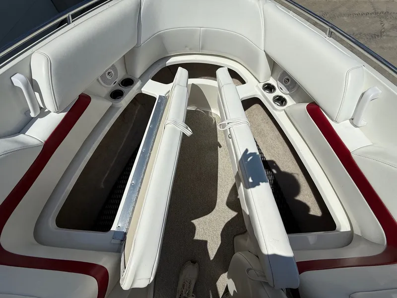 Slide: The Image of Interior of a 2001 Formula F-260 boat with white and red seating. - 12
