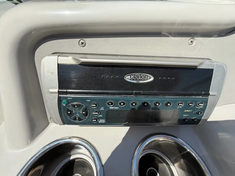 Slide: The Image of Clarion stereo system on 2001 Formula F-260 boat dashboard with cup holders. - 18