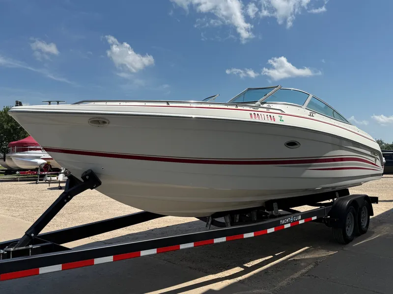 Slide: The Image of 2001 Formula F-260 boat on trailer under clear blue sky. - 2