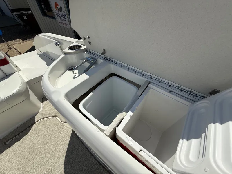 Slide: The Image of Open storage compartment on a 2001 Formula F-260 boat with cooler and sink. - 23