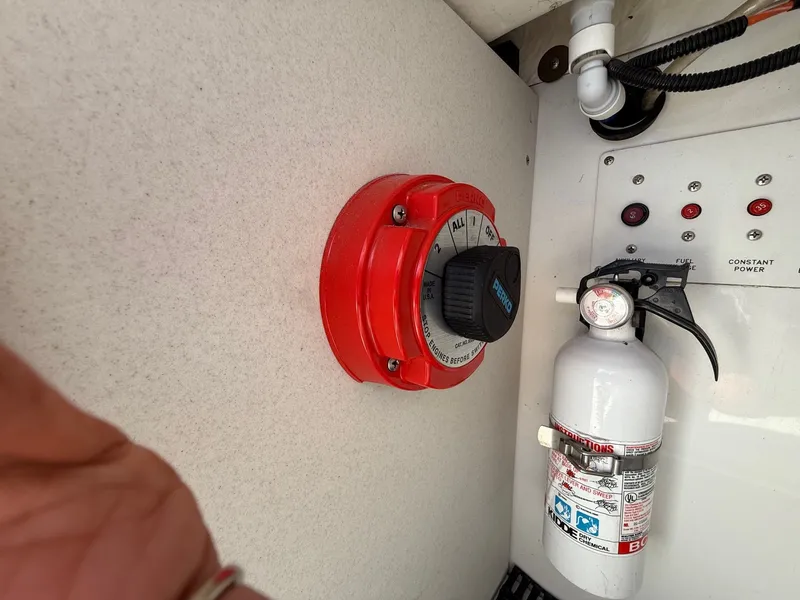 Slide: The Image of Control panel with red switch and fire extinguisher on Formula F-260 boat, 2001 model. - 25