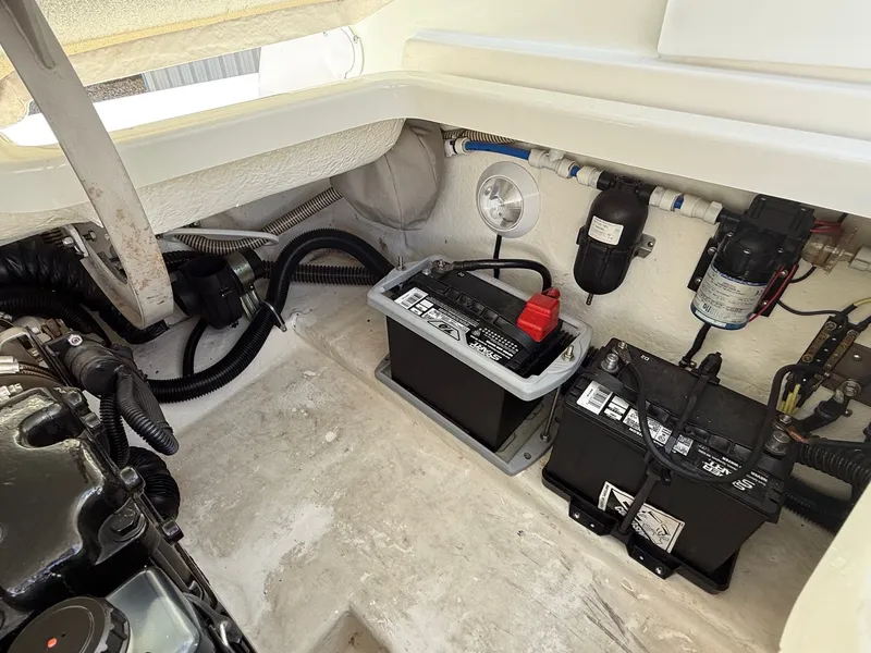 Slide: The Image of Engine compartment of a 2001 Formula F-260 boat with batteries and wiring. - 30