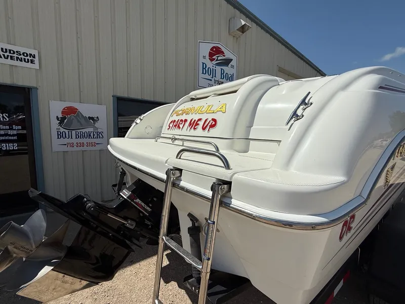Slide: The Image of 2001 Formula F-260 boat at Boji Brokers, featuring "Start Me Up" text on the stern. - 6