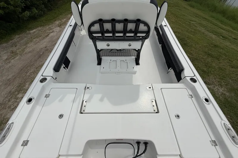 Slide: The Image of 2026 Tidewater 2300 Carolina Bay boat interior with seating and storage compartments. - 12
