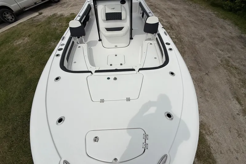 Slide: The Image of 2026 Tidewater 2300 Carolina Bay boat interior, featuring spacious seating and storage compartments. - 17